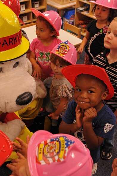 Sparky the fire dog meets with children at the Child Development Center as a part of Fire Prevention Week, Oct. 12, 2011, at Dyess Air Force Base, Texas.  Fire Prevention Week is geared towards placing emphasis on fire and safety and is structured to reach the maximum amount of people in the Dyess community. (U.S. Air Force photo by Airman 1st Class Peter Thompson/Released)