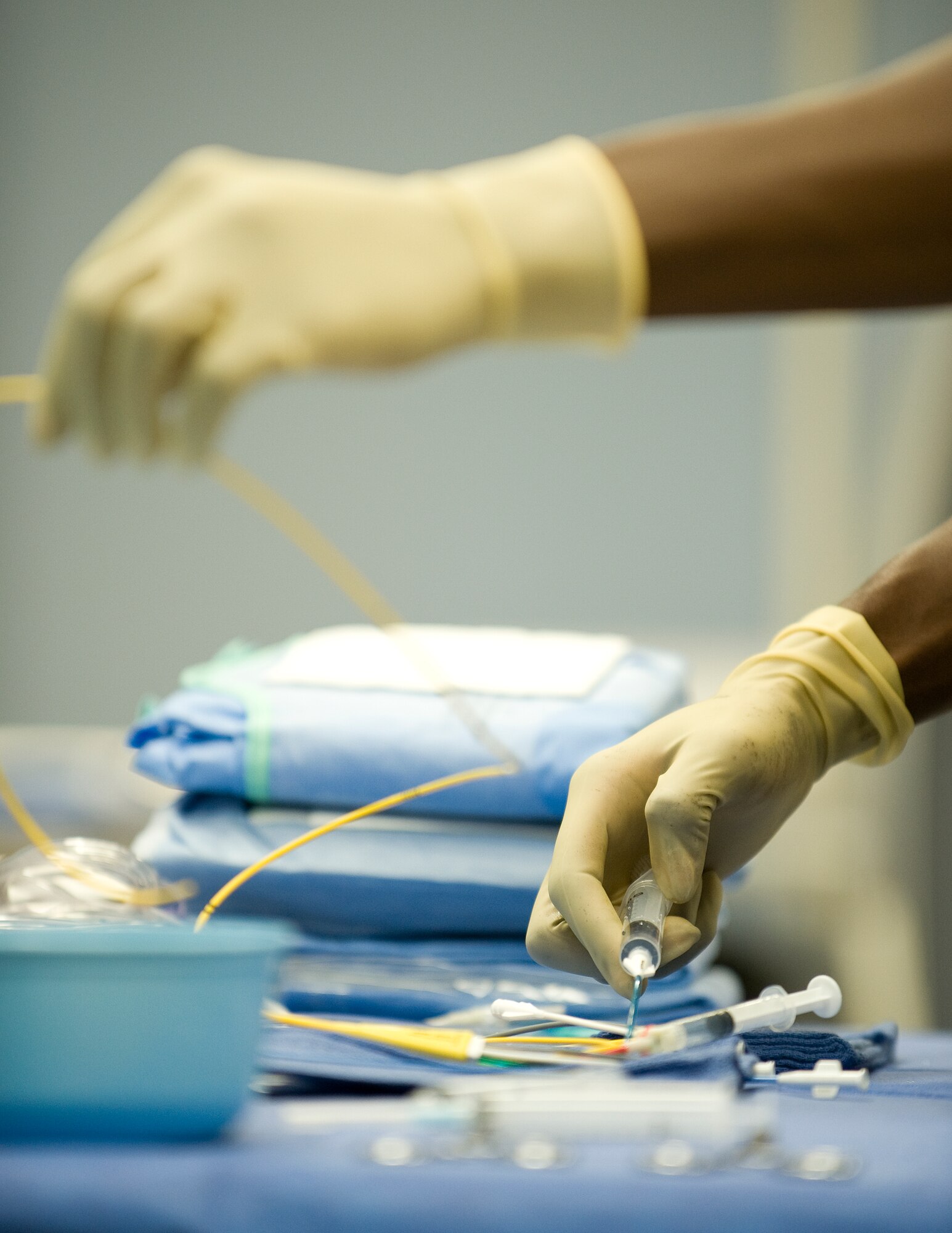Will Henderson, 99th Medical Operations Squadron registered cardiac invasive specialist, prepares equipment prior to the catheterization laboratory's first live procedure Oct. 13, 2011, at Nellis Air force Base, Nev. The procedure is the end-all diagnostic to test for blockages in a patient's arteries and will benefit patients with severe coronary risk factors. (U.S. Air Force photo by Staff Sgt. Christopher Hubenthal/Released)
