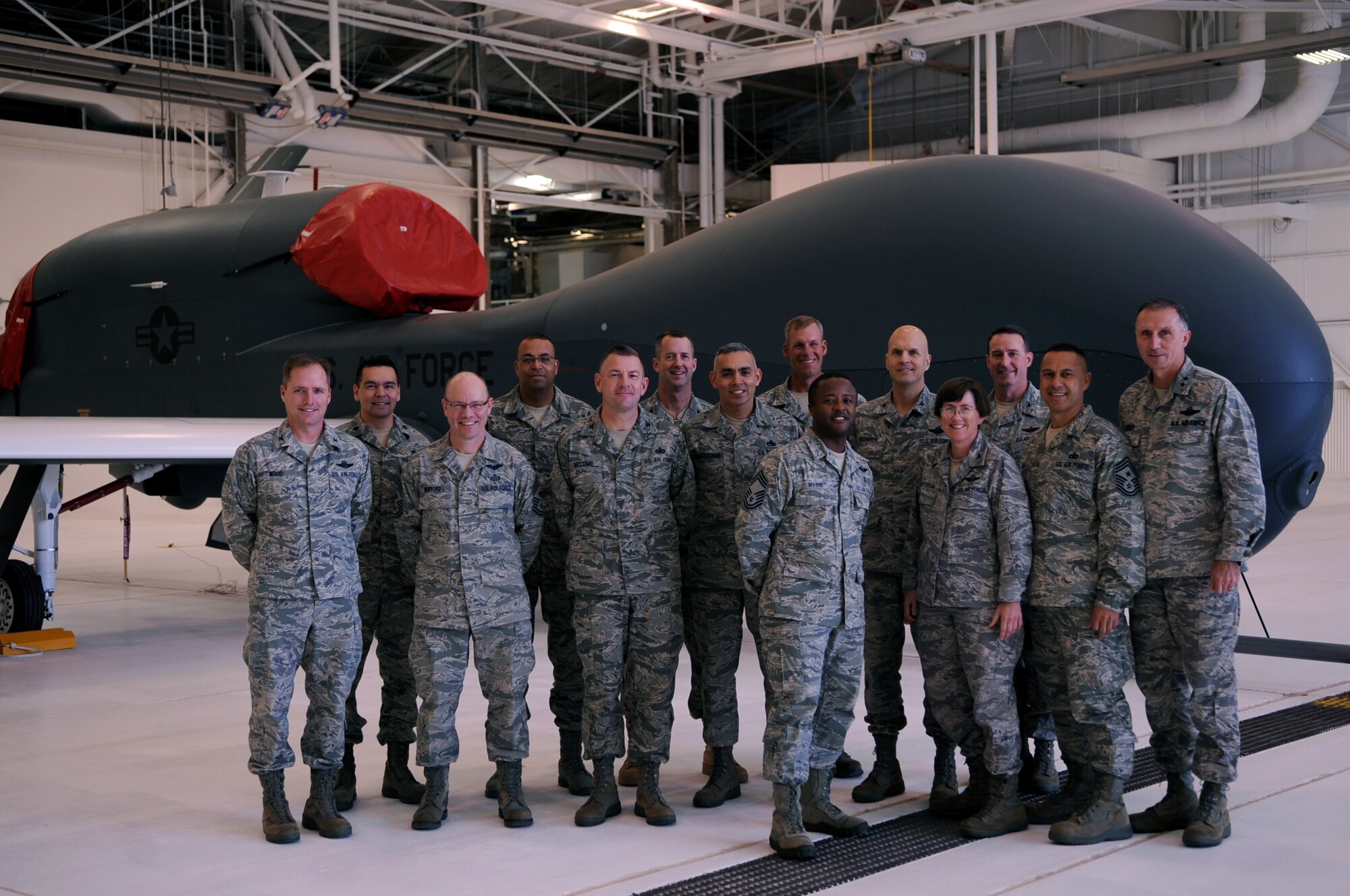 Members of the U.S. Air Force Expeditionary Center’s Commander’s Conference pose for a group photo in front of an RQ-4 Global Hawk on Grand Forks Air Force Base, N.D., on Oct. 13. The conference was held Oct. 12-14. (U.S. Air Force photo by Senior Airman Amanda N. Stencil)