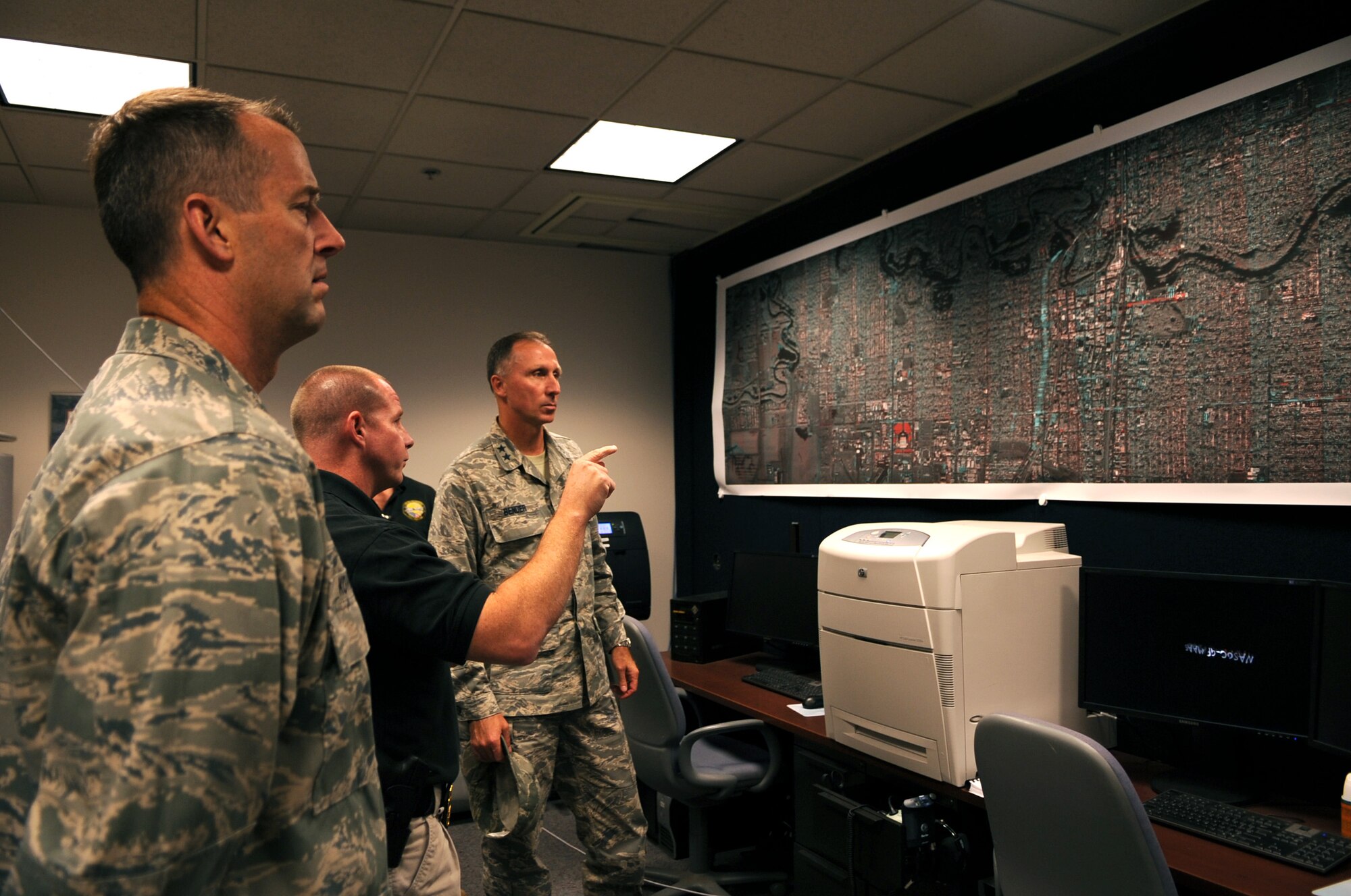 John Priddy (right), director of North Dakota Air Operations of Department of Homeland Security, briefs Maj. Gen. William Bender (left), United States Air Force Expeditionary Center commander, on the departments’  role in North Dakota during an Oct. 13 tour of Grand Forks Air Force Base. (U.S. Air Force photo by Senior Airman Amanda N. Stencil)