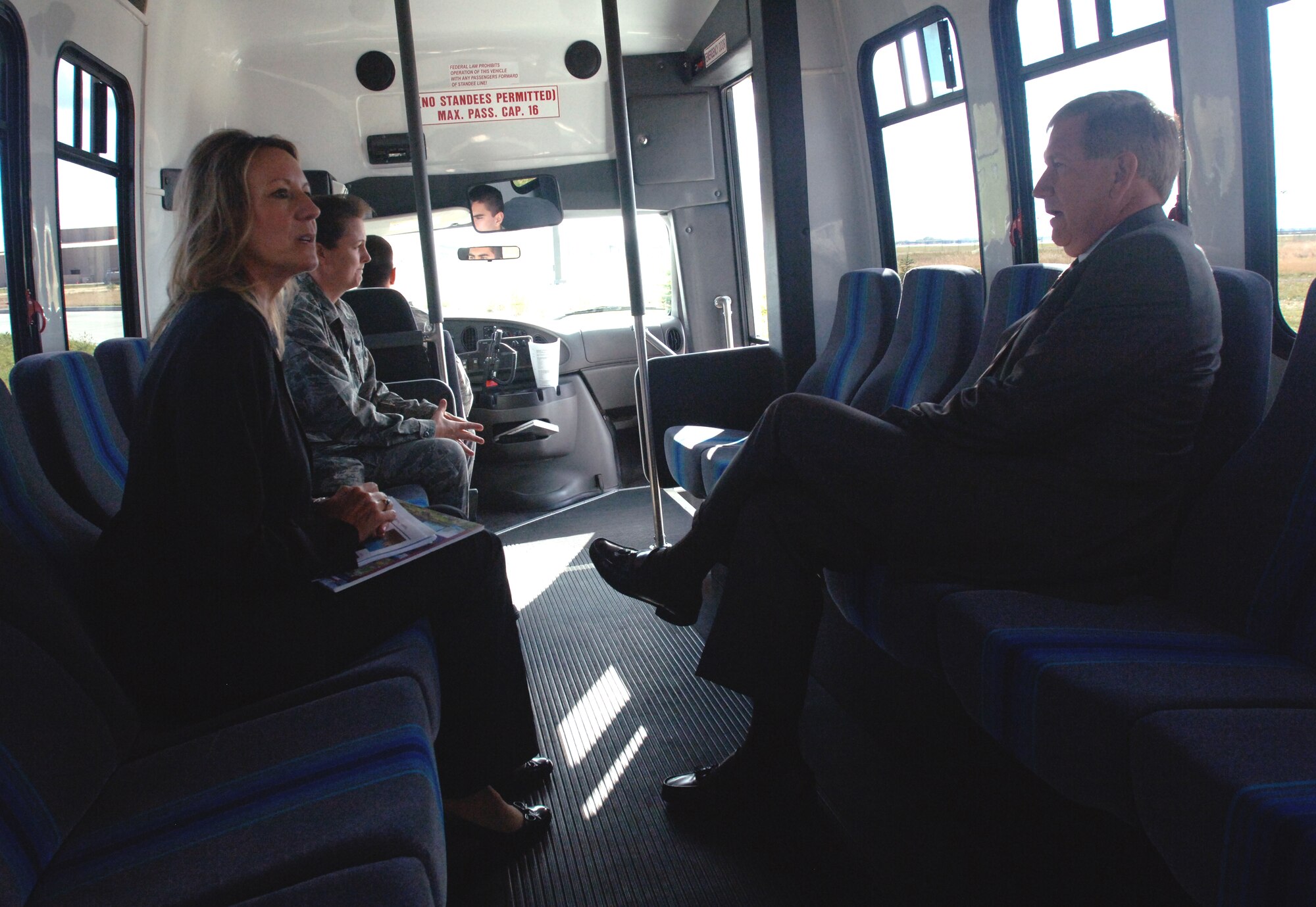 Mary Giltner, 319th Civil Engineer Squadron deputy base civil engineer, briefs Terry Yonkers, Assistant Secretary of the Air Force for Installations, Environment and Logistics, during a bus tour of the base on Oct. 13. (U.S. Air Force photo/Tim Flack)