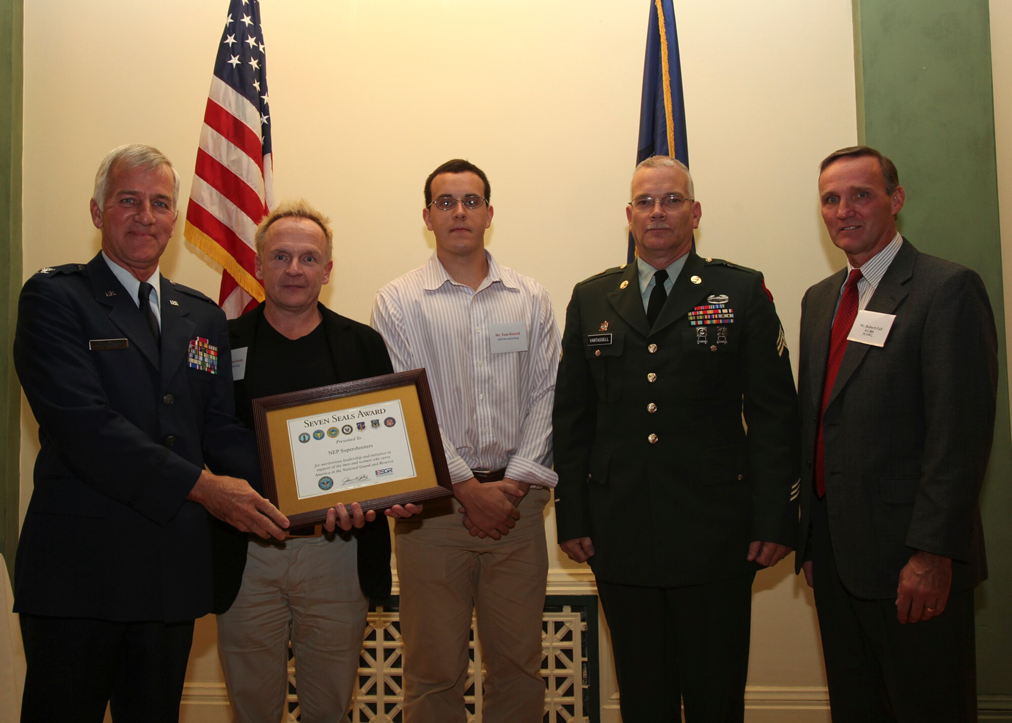 Tom Dausch and Terrence Brady accept the Seven Seals Award on behalf of NEP Broadcasting, Oct. 11. The Seven Seals Award is given at the discretion of the Pennsylvania Employer Support Guard and Reserve Chairman to recognize the efforts by a citizen business or organization whose supportive actions have benefited all of the reserve components in a significant manner.