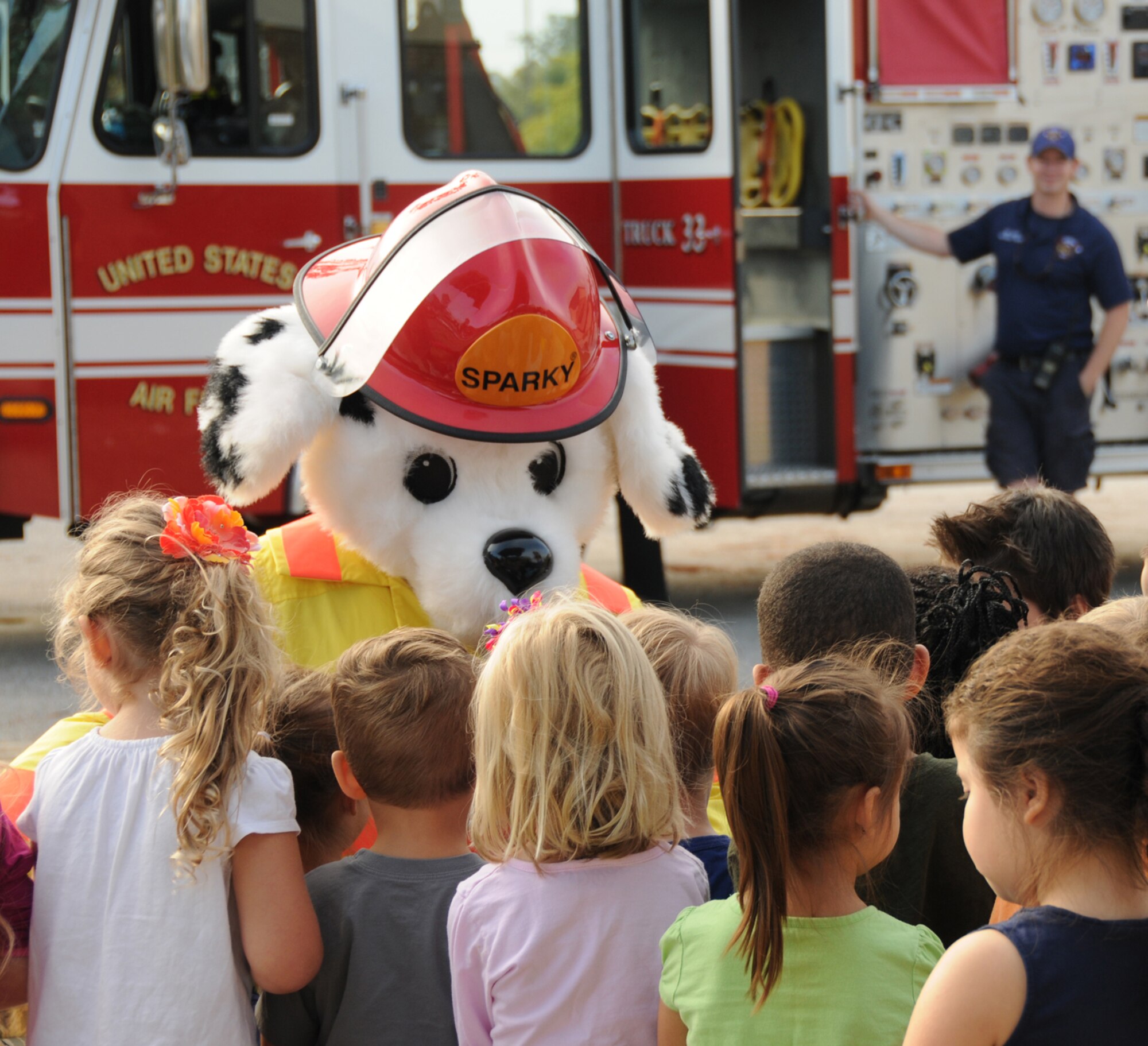 Sparky the Fire dog, greets children at the Child Development Center Oct. 12, 2011.  Fire Prevention week is Oct. 11-15.  (U.S. Air Force photo by Kemberly Groue)