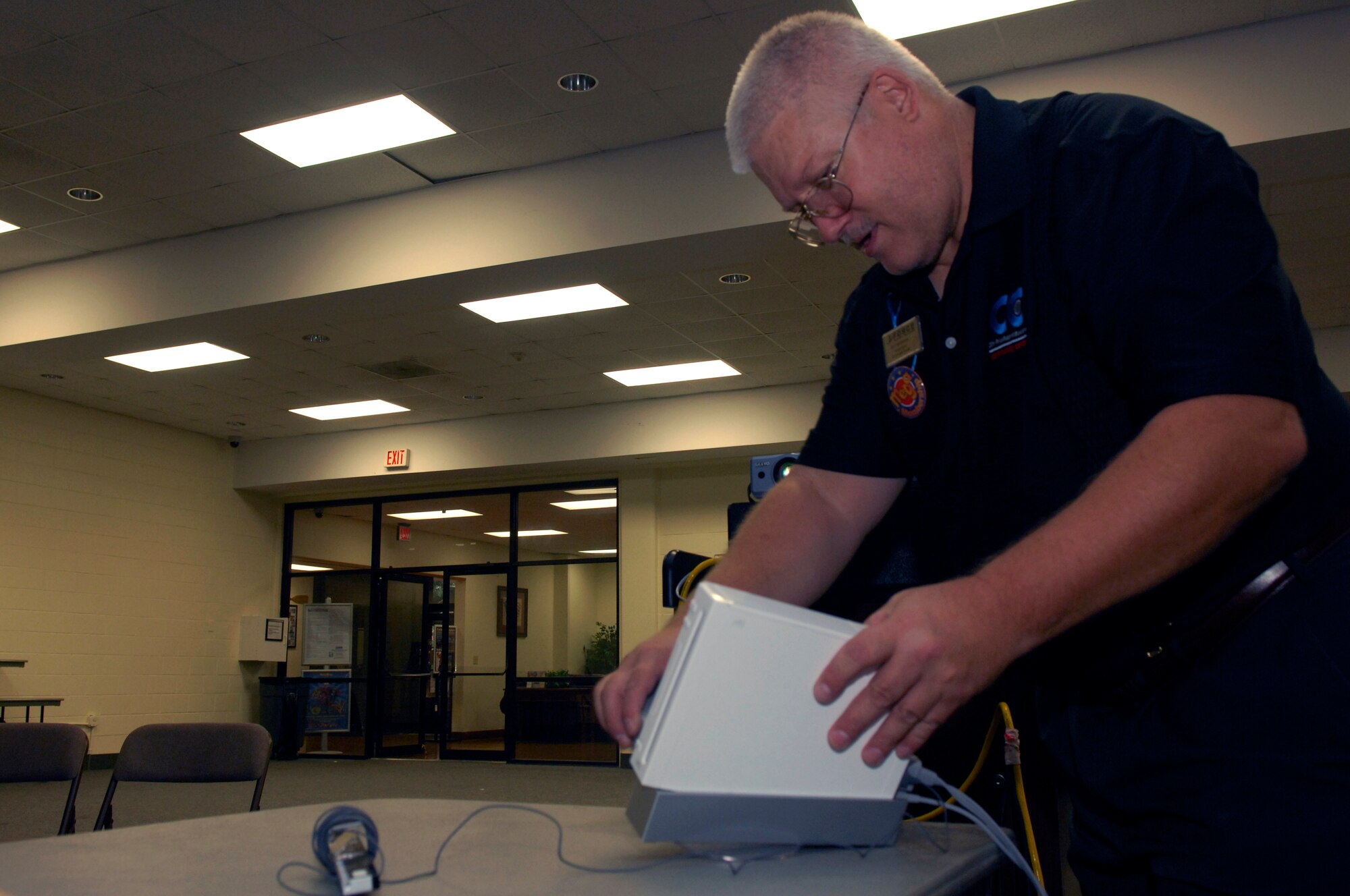 U.S. Air Force Civ Edward Haldeman, 20th Force Support Squadron, makes sure the Wii gaming system at the Community Center for retiree Thursday, Shaw Air Force Base, S.C. Oct. 13, 2011. The Shaw Community Center game room has 6 Xbox systems and 2 Playstation 3 systems as well as 150 games. (U.S. Air Force photo by Airman 1st Class Ashley L. Gardner/ Released)