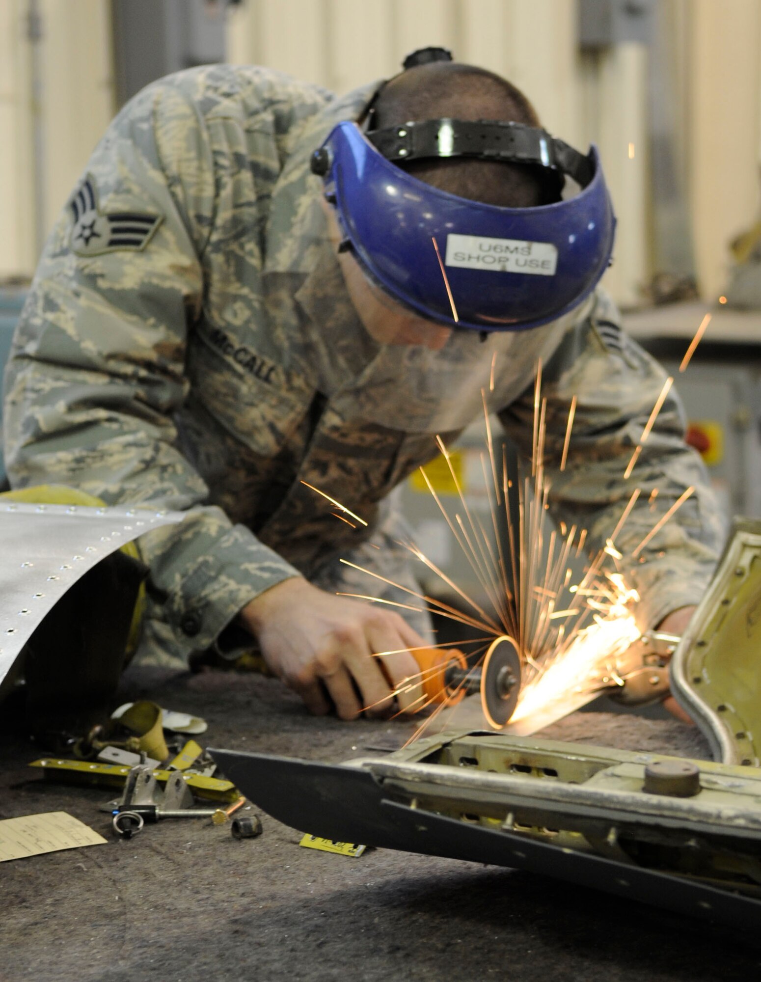 Senior Airman Colton McCall, 2nd Maintenance Squadron aircraft structural maintenance journeyman, fixes a drag chute door from a B-52 by fabricating a bracket for structural support Oct. 13 at Barksdale Air Force Base, La. McCall is an active-duty Airman working with reservists at the 307th Maintenance Squadron as part of the Total Force Integration Program. (U.S. Air Force photo/Airman 1st Class Andrea F. Liechti)(RELEASED)