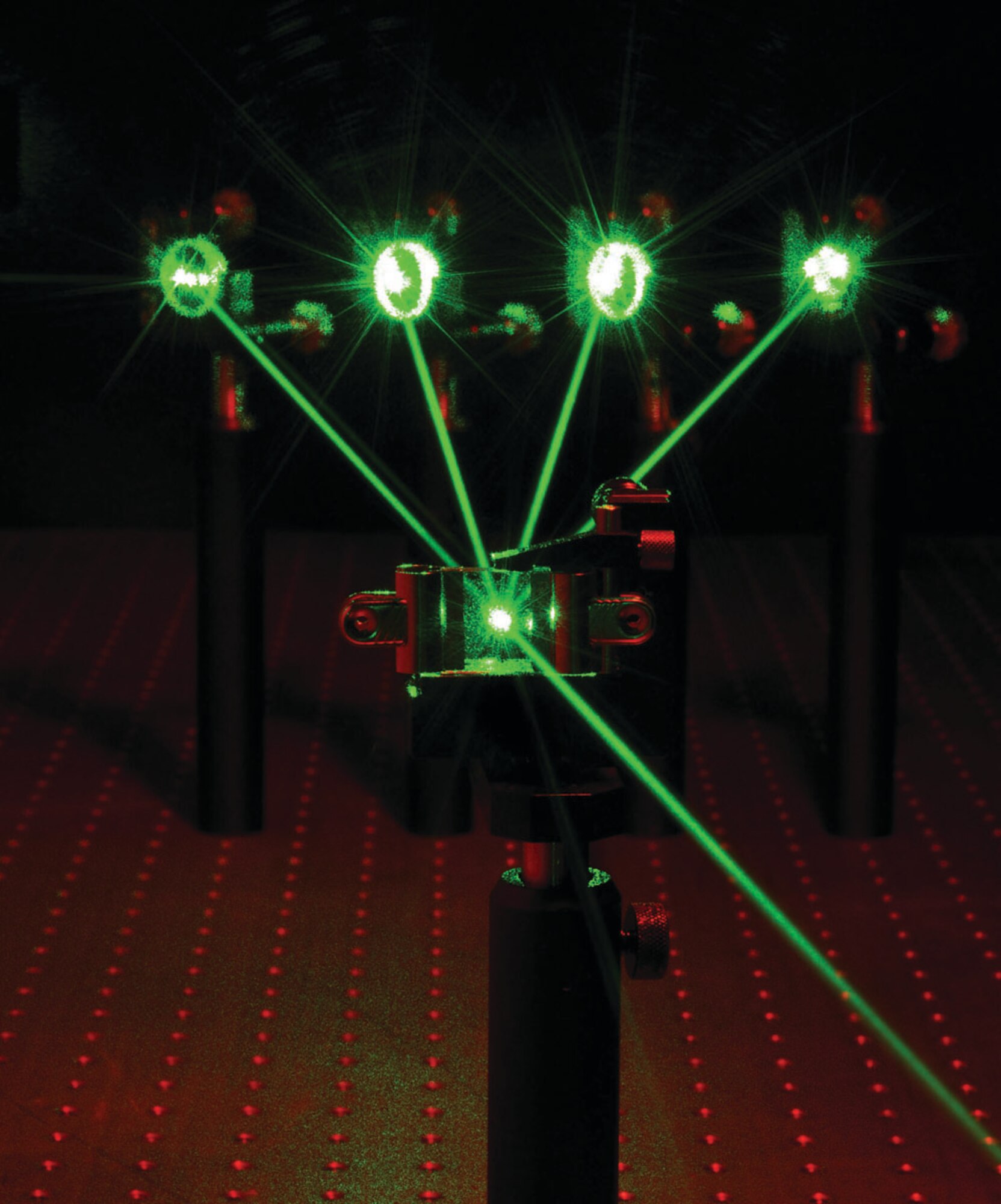 Photorefractive beam coupling in a photorefractive organic-inorganic hybrid device: several laser beams entering a photorefractive hybrid cell resulting in a single combined (amplified) coherent beam.  (AFRL Image)