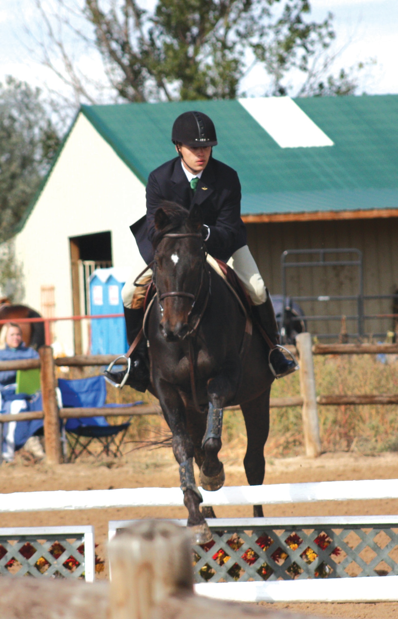 Cadet 3rd Class Cole Donnelly, of Cadet Squadron 19, negotiates a jump during an equestrian competition in Fort Lupton, Colo. (U.S. Air Force Photo)