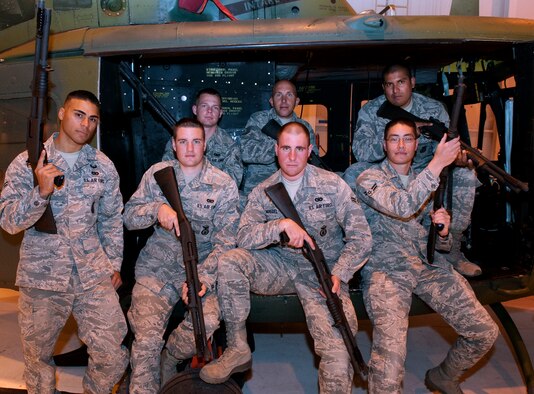 Warren’s defenders for the second annual Global Strike Challenge pose for a team photo near an UH-1N Huey helicopter Oct. 7. The team consists of Senior Airman Oscar Gomez, 90th Security Forces Group Tactical Response Force; Senior Airman Patrick Currie, 90th Missile Security Forces Squadron; Airman 1st Class James Clingo, 790th Missile Security Forces Squadron; Tech. Sgt. Derrick Grant, 90th SFG/TRF; Airman 1st Class John Maedel, 790th MSFS; Airman 1st Class Derek Woods, 790th MSFS; and Staff Sgt. Ernie Luna, 90th SFG/TRF. (U.S. Air Force photo by R.J. Oriez)