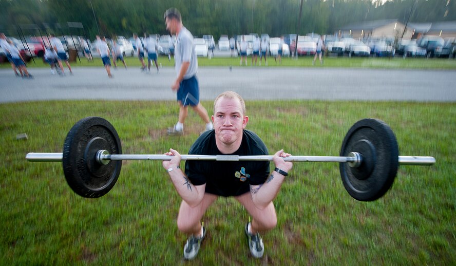 Officer Joseph Suhr, Lowndes County Sheriff’s Office, performs squat thrusts during the annual LeenBernard Chavis Memorial Workout Oct. 14, 2011, at Moody Air Force Base, Ga. Suhr is a former member of the 824th Base Defense Squadron and was deployed with Airman 1st Class Chavis in Baghdad, Iraq, when he was killed. Suhr has participated in three workouts to commemorate Chavis. (U.S. Air Force photo by Staff Sgt. Jamal D. Sutter/Released) 