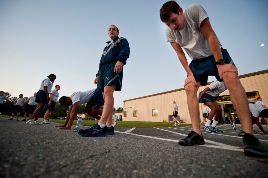 Members of the 820th Base Defense Group take a moment to rest during the annual LeeBernard Chavis Memorial Workout Oct. 14, 2011, at Moody Air Force Base, Ga. The workout consists of 150 burpees, a one-mile run and 150 squat thrusts. The 820th BDG began the annual workout in 2008 in commemoration of Airman 1st Class LeeBernard Chavis, a fallen member of the 824th Base Defense Squadron who was killed in action while deployed to Baghdad, Iraq, in 2006. (U.S. Air Force photo by Staff Sgt. Jamal D. Sutter/Released)
