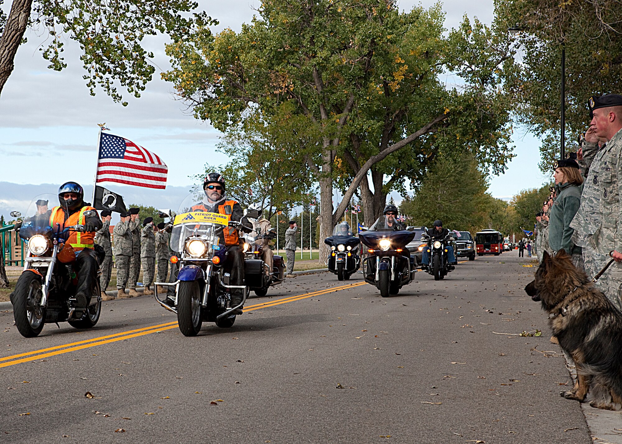 Warren members align Ft. Warren Avenue Oct. 11 as a motorcycle formation precedes a bus containing World War II veterans who are going to Washington D.C. as part of the final Honor Flight. (U.S. Air Force photo by Matt Bilden)