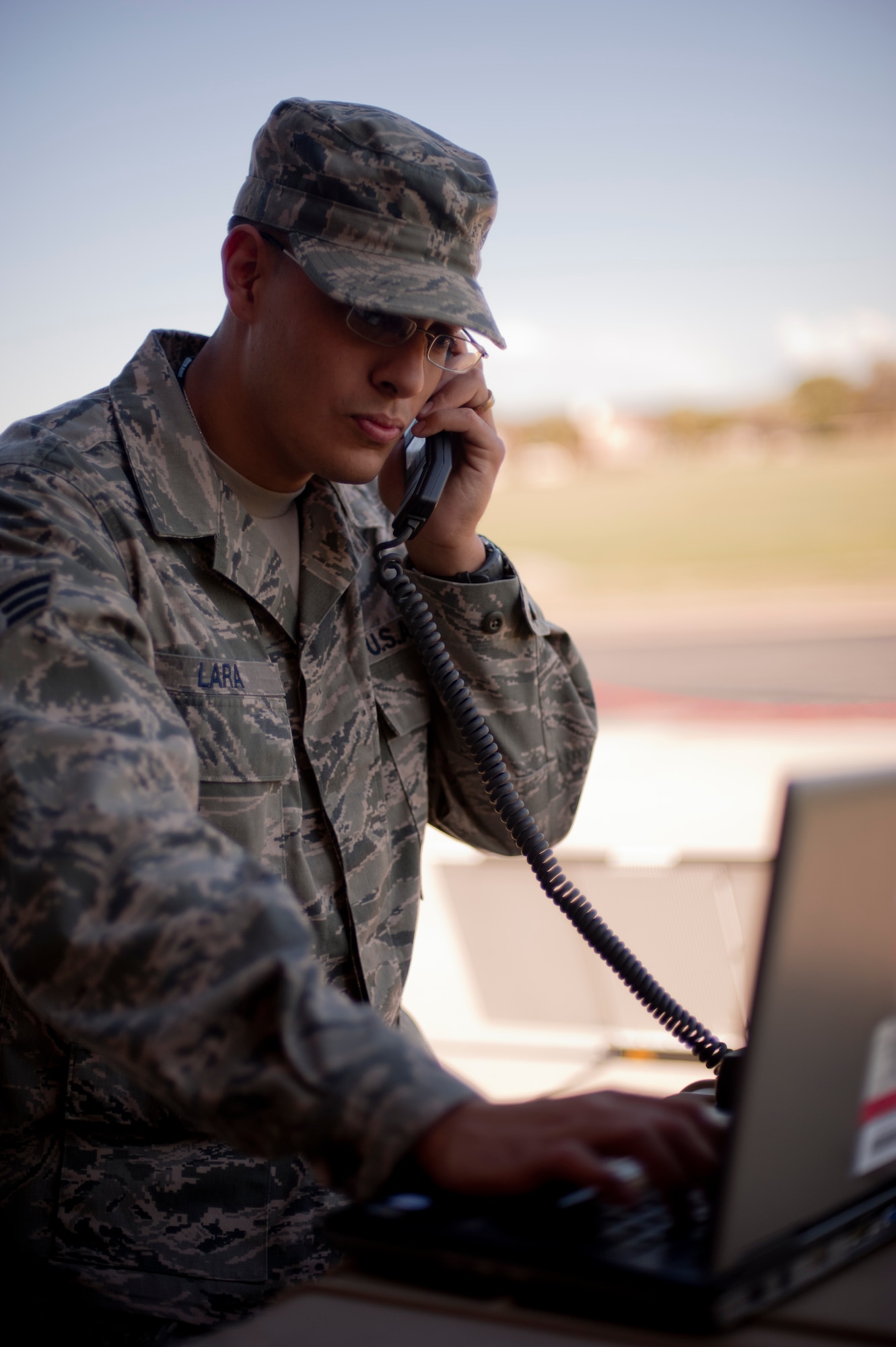 Senior Airman Patrick Lara, 22nd Operations Group training intelligence analyst, tests a mobile satellite Oct. 12, 2011, McConnell Air Force Base, Kan. The Austin, Texas, native also trains aircrew personnel and keeps senior leadership informed. (U.S. Air Force photo by Airman 1st Class Armando A. Schwier-Morales) 