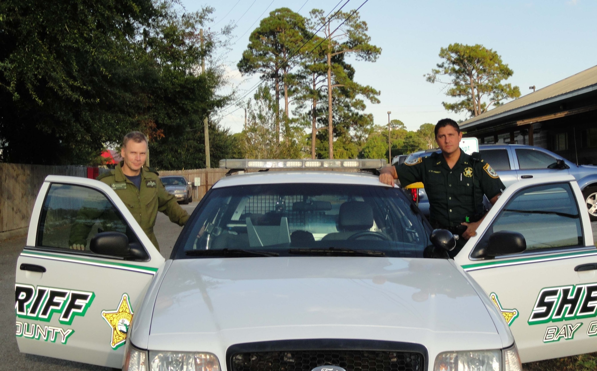 BGen. Christopher Coates, Continental U.S. North American Aerospace Defense Region deputy commander joins Lt. Kevin Francis, Bay County Sheriff’s Office Deputy for the first part of the evening’s shift. (Air Force Photo by Mary McHale)
