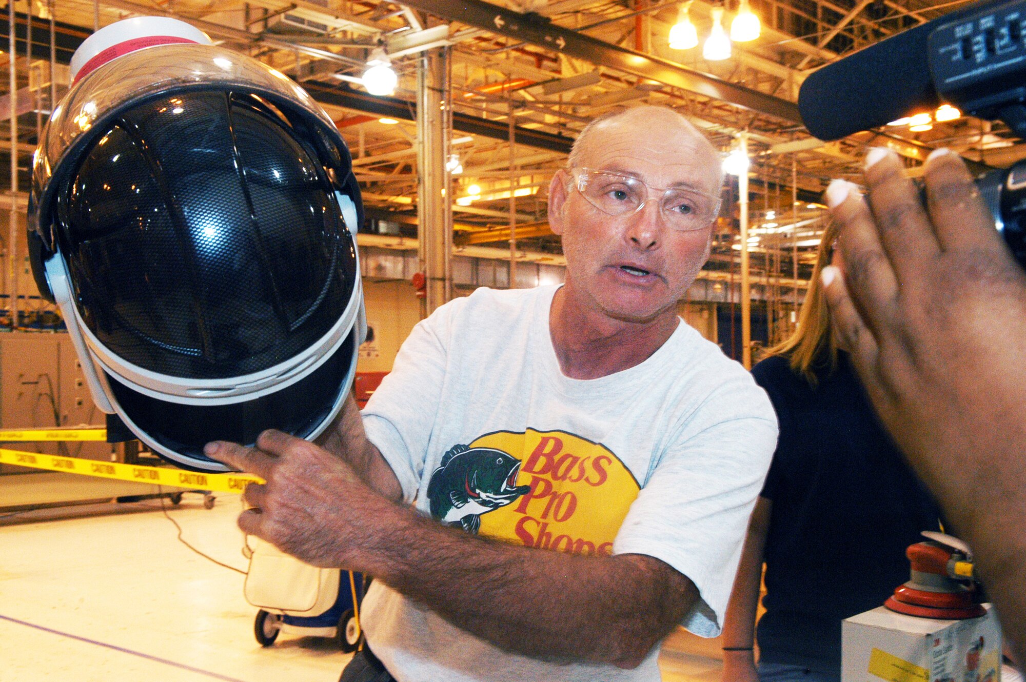 Ronnie Gadola, 574th Composite Repair Flight sheet metal mechanic, displays a Purflo helmet, part of a new generation of respirators used at Robins. U. S. Air Force photo by Sue Sapp