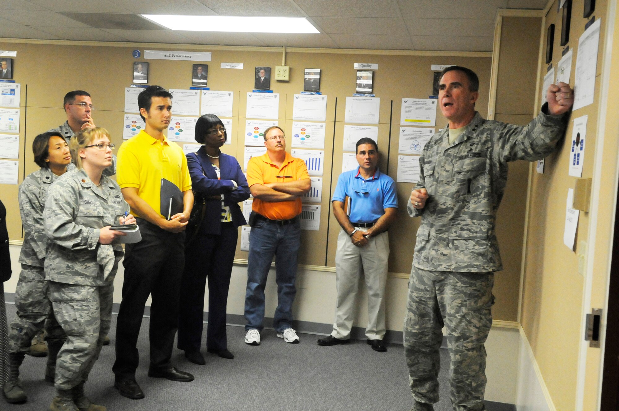 Maj. Gen. Robert McMahon, Warner Robins Air Logistics Center commander, in July discusses the uses and importance of the Mission Control Room to a group of center employees. U.S. Air Force file photo by Sue Sapp