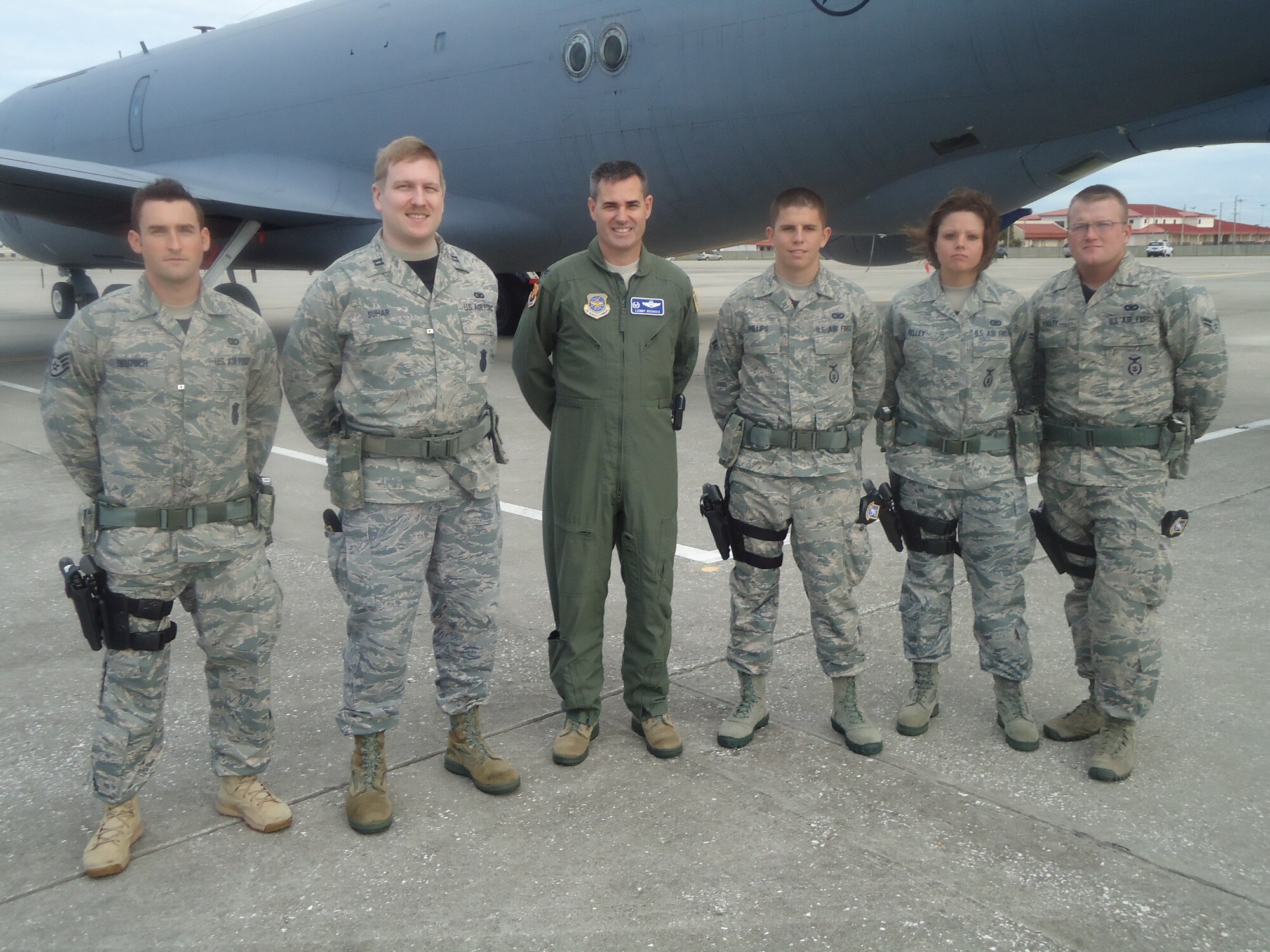 Col. Lenny Richoux, the 6th Air Mobility Wing commander, with some members of the 6th Security Forces Squadron at the Cars and Coffee event Oct. 8, 2011 at MacDill Air Force Base, Fla. (Courtesy photo)