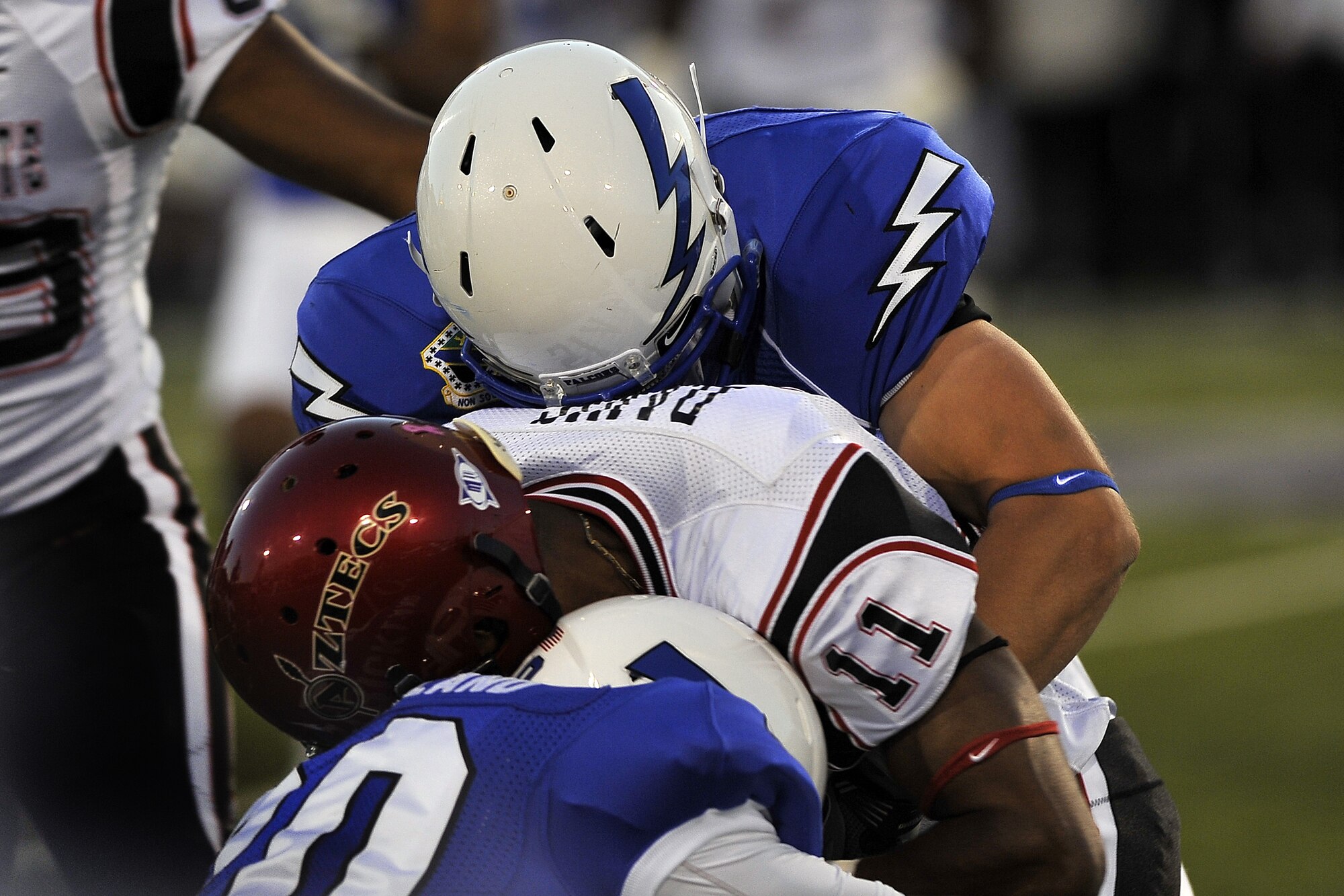 San Diego State's Brandon Davis is wrapped up by Air Force defenders during the Aztecs-Falcons game at Falcon Stadium Oct. 13, 2011. The Aztecs had 410 yards of total offense in their 41-27 victory over Air Force. (U.S. Air Force photo/Bill Evans)