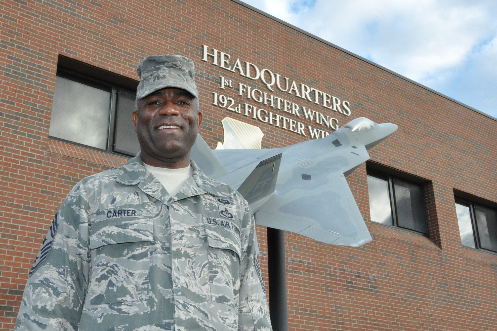 Chief Master Sgt. Gary Carter is the 1st Fighter Wing command chief at Joint Base Langley-Eustis, Va. He is responsible to the 1st FW commander for the effective employment, professional development, good order and discipline of roughly 1,400 enlisted personnel who operate and maintain the F-22 Raptor. (U.S. Air Force photo by Tech. Sgt. Randy Redman/Released)