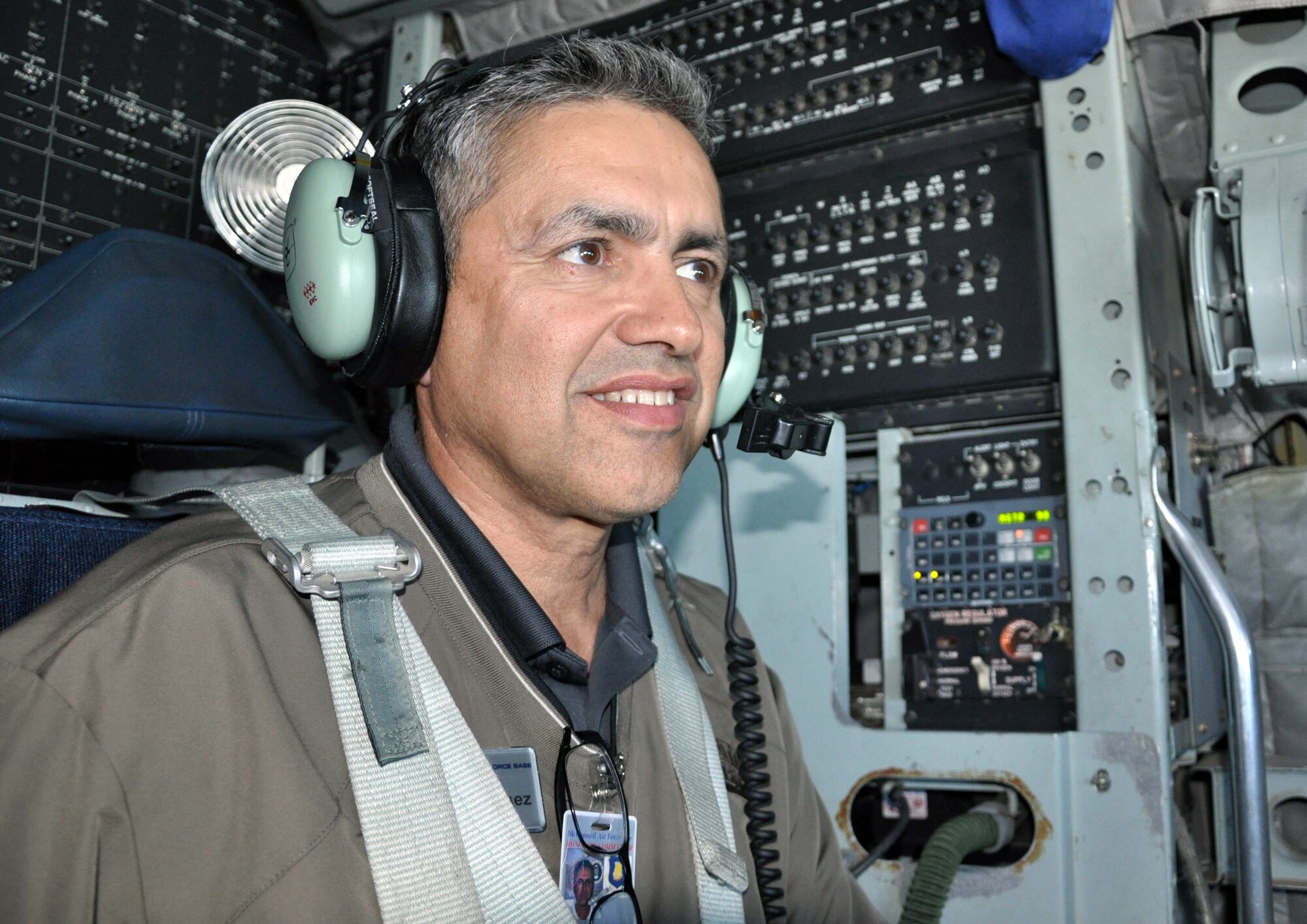 Jorge Martinez, honorary commander of the 931st Air Refueling Group, enjoys the view from the cockpit of a KC-135 Stratotanker during an orientation flight at McConnell Air Force Base, Kan., Oct. 13, 2011.  Twenty-one honorary commanders took part in the flight, which familiarized them with the mission of the 931st Air Refueling Group and the 22nd Air Refueling Wing. (U.S. Air Force photo by 1st Lt. Zach Anderson)