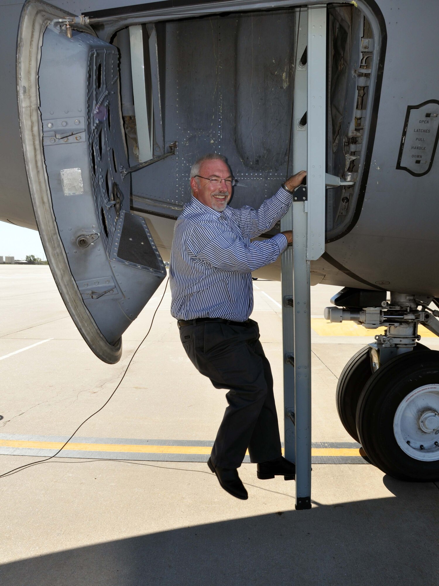 Dr. David Hufford, honorary commander of the 931st Air Refueling Group Aerospace Medicine Squadron, climbs down the crew ladder of a KC-135 Stratotanker prior to an orientation flight at McConnell Air Force Base, Kan., Oct. 13, 2011.  Twenty-one honorary commanders took part in the flight, which familiarized them with the mission of the 931st Air Refueling Group and the 22nd Air Refueling Wing. (U.S. Air Force photo by 1st Lt. Zach Anderson)
