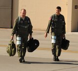 Lt. Col. David Drichta, 435th Fighter Training Squadron commander, and Lt. Col. Gregory Keeton, 434th Fighter Training Squadron commander, walk to two T-38C Talons at Laughlin Air Force Base, Texas, Oct. 4.  The two jets were bound for their new home Randolph Air Force Base, Texas.  The jets were the first two of 20 to be transferred to the 435th Fighter Training Squadron at Randolph as part of the consolidation of the Introduction to Figher Fundamentals training course.  In addition to the 20 T-38Cs,  the 435th FTS will receive 11 active duty instructor pilots, more than 30 support positions, and 80 additional students annually due to the consolidation. (U.S. Air Force Photo by Senior Airman Blake Mize)