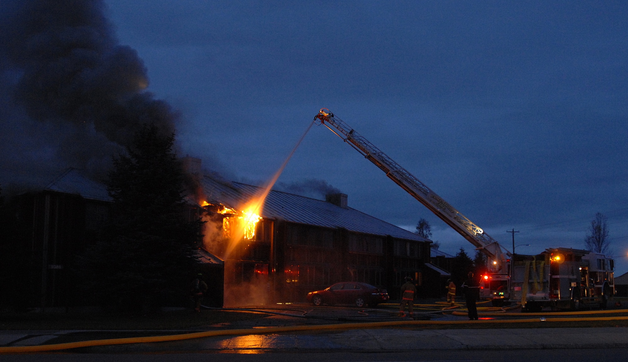 Joint Base Elmendorf-Richardson firefighters battle a fire at building 9386 on JBER October 13, 2011. All occupants of the lodging facility were accounted for and no injuries were reported. (U.S. Air Force photo/Staff Sgt. Zachary Wolf)(Released)