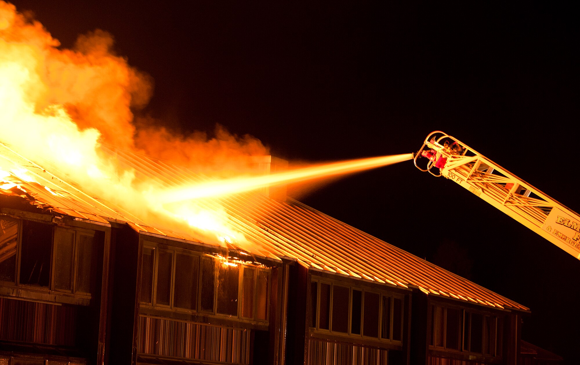 Joint Base Elmendorf-Richardson firefighters battle a fire at building 9386 on JBER October 13, 2011. All occupants of the lodging facility were accounted for and no injuries were reported. (U.S. Air Force photo/Staff Sgt. Zachary Wolf)(Released)