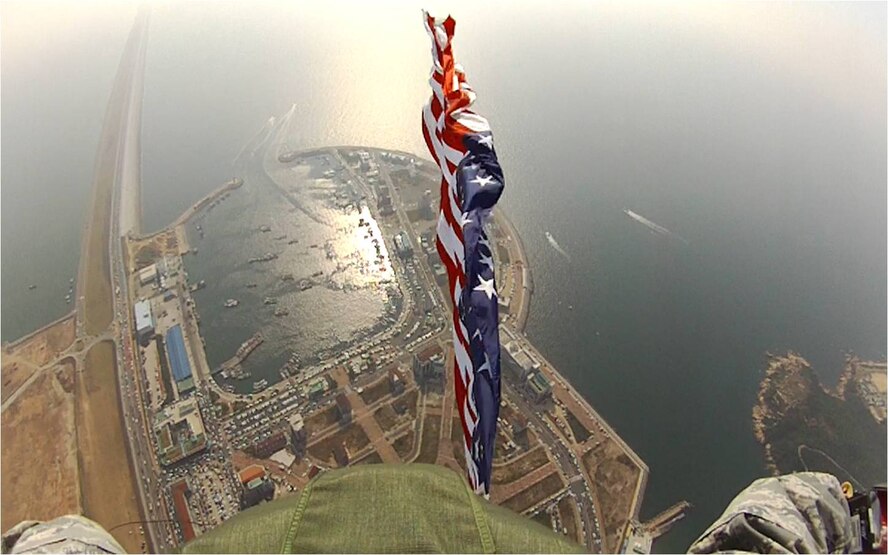 Tech. Sgt. Jason Martinez, 8th Operations Support Squadron weapons and tactics NCO in charge, looks behind him as he descends after jumping from a C-130H Hercules during the 2011 Gunsan--Saemangeum Air Show at Gunsan City, Republic of Korea, Oct. 9, 2011. The air show featured many static displays and performances from across the Pacific Air Forces and Korean peninsula. (U.S. Air Force photo by Tech. Sgt. Jason Martinez/Released)