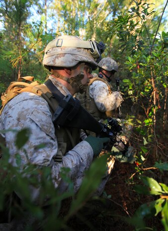 Lance Cpl. Seth Jarboe, a rifleman with 2nd Platoon, Bravo Company, 1st Battalion, 2nd Marine Regiment, provides rear security during a simulated raid as part of the Vertical Assault Course at the Military Operations in Urban Terrain training center aboard Camp Lejeune, N.C., Oct. 14th, 2011. The Vertical Assault Course is taking place Oct. 10-21 to provide Marines and Sailors of Bravo Co. familiarization with air operations for their upcoming deployment as the Battalion Landing Team for the 24th Marine Expeditionary Unit. The company serves as the battalion’s vertical assault element, meaning they insert and extract from areas by helicopter.