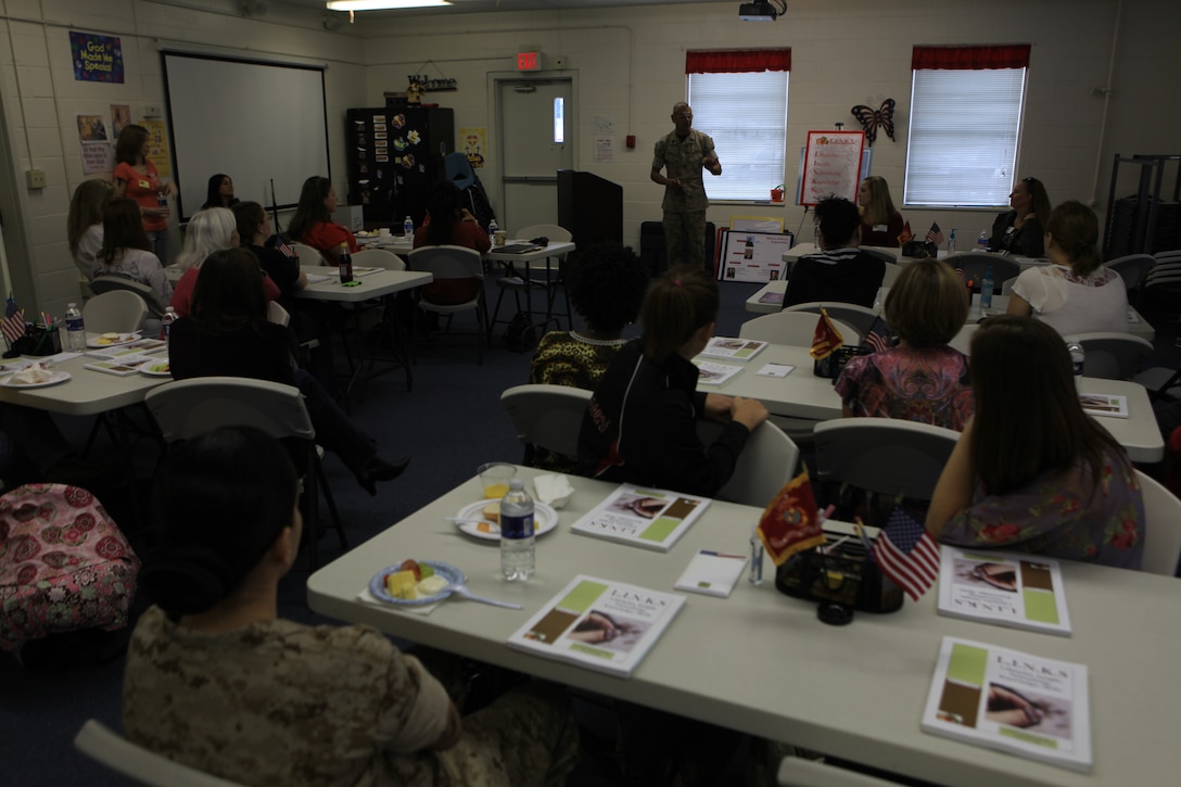 Sgt. Maj. Octaviano Gallegos, the 24th Marine Expeditionary Unit's Sergeant Major, talks to spouses of the 24th MEU Marines and Sailors during a Lifestyles, Insights, Networking, Knowledge and Skills (L.I.N.K.S.) class aboard Camp Lejeune on October 14, 2011.