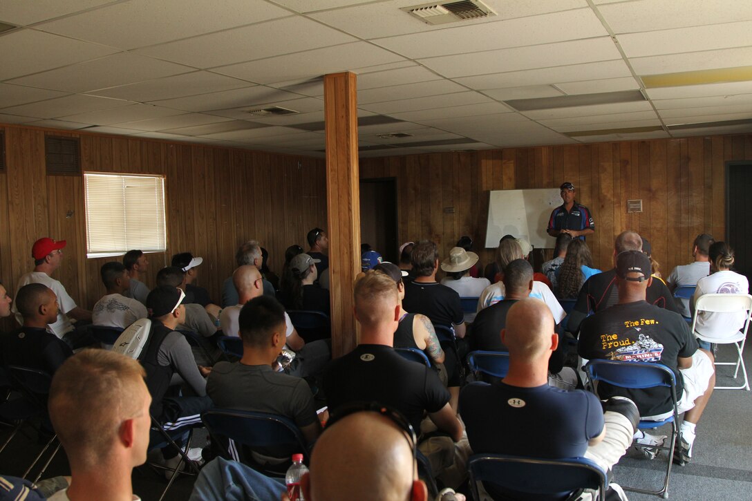 Jason Pridmore, owner and operator of Star Motorcycle School, explains the goals of his school to Marines and civilians during the first class of the dayat Chuckwalla Valley Raceway, in Desert Center, Calif., Oct. 15, 2011.