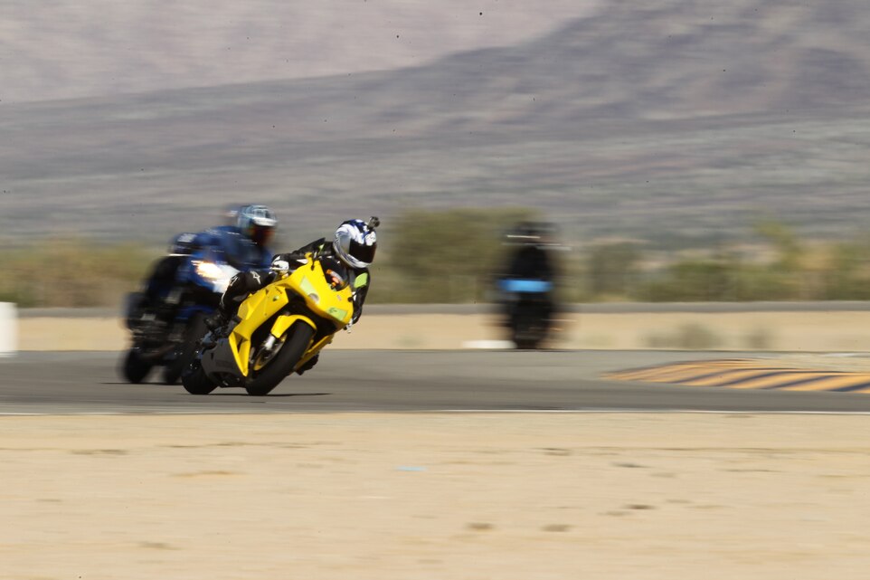 Sgt. David Wong, administrative specialist with the Wounded Warrior detachment, tests his limits on the turns at the Chuckwalla Valley Raceway, in Desert Center, Calif., during the Jason Pridmore Star Motorcycle School Oct. 15, 2011.