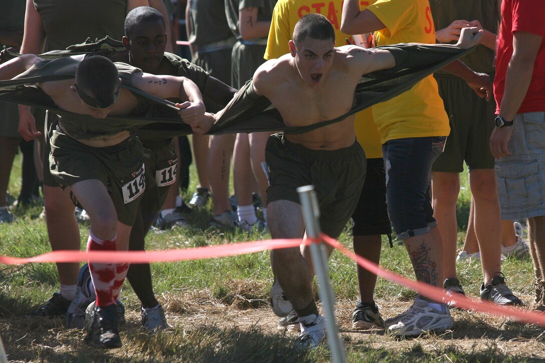 Members of Fort Hill High School’s JROTC program rip through the starting line at the USMC Ultimate Challenge Mud Run in Columbia, S.C., Oct. 15. Fort Hill’s JROTC joined in the event as a morale booster with select members participating competitively.  (Official USMC photo by Cpl. Chris Kutlesa)
