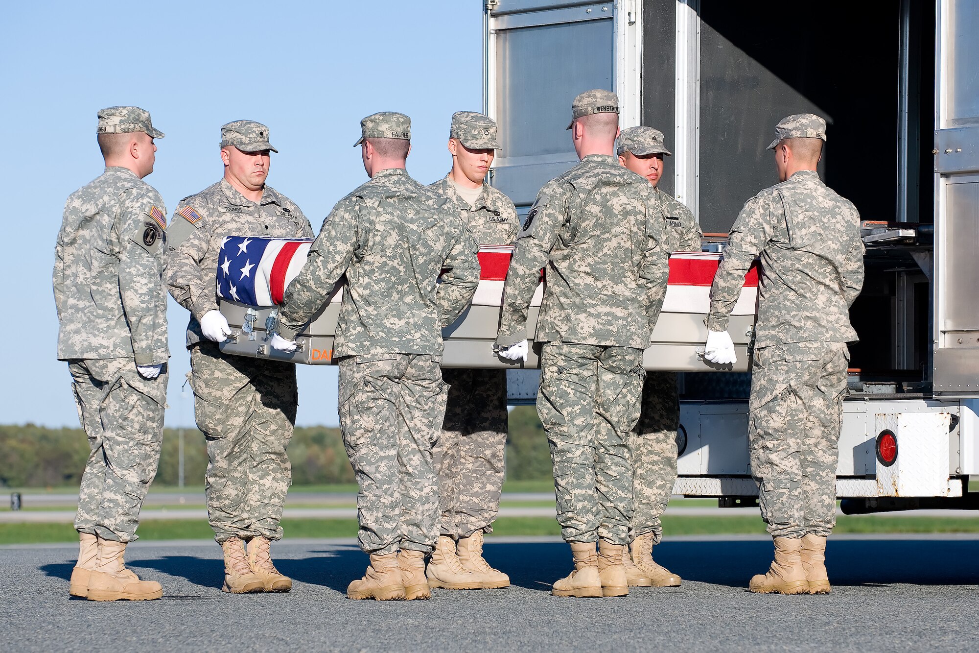 A U.S. Army carry team transfers the remains of Army Spc. Jeremiah T. Sancho of Palm Bay, Fla., at Dover Air Force Base, Del., Oct. 15, 2011. Sancho was assigned to the 3rd Squadron, 71st Cavalry Regiment, 3rd Brigade Combat Team, 10th Mountain Division, Fort Drum, N.Y. (U.S. Air Force photo/Adrian Rowan)

