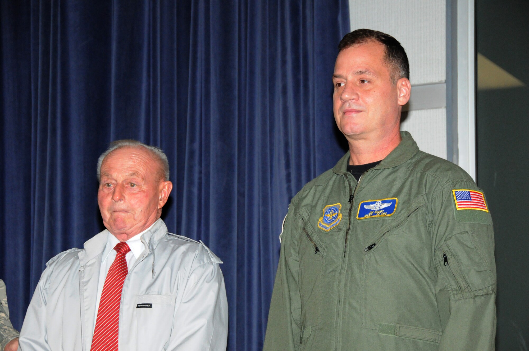 Senior Master Sgt. (Ret.) John R. Quigley (left), a Del. Air National Guard C-130 aircraft flight engineer and combat veteran of Desert Shield and Desert Storm (1990-1991), and a resident of Frankford, Del., is presented the Military Airlift Command Individual Flying-Hour Milestone Award for attaining 15,000 mishap-free flying hours by 166th Airlift Wing Commander Col. Jonathan Groff during the 16th Annual Del. Air National Guard Retirees' Breakfast and FY 2012 Honoree ceremony on Oct. 14, 2011 at wing HQ, New Castle, Del. This award was overlooked 21 years ago as the unit prepared to deploy overseas in Aug. 1990 after Iraq invaded Kuwait. Master Sgt. James D. Godby (right), an instructor loadmaster and current member of the 142nd Airlift Squadron, Del. ANG, and a resident of Newark, Del. reached the 10,000 mishap-free flying hour milestone last month, and is presented the Air Mobility Command award. (U.S. Air Force photo/Tech. Sgt. Harold Herglotz)