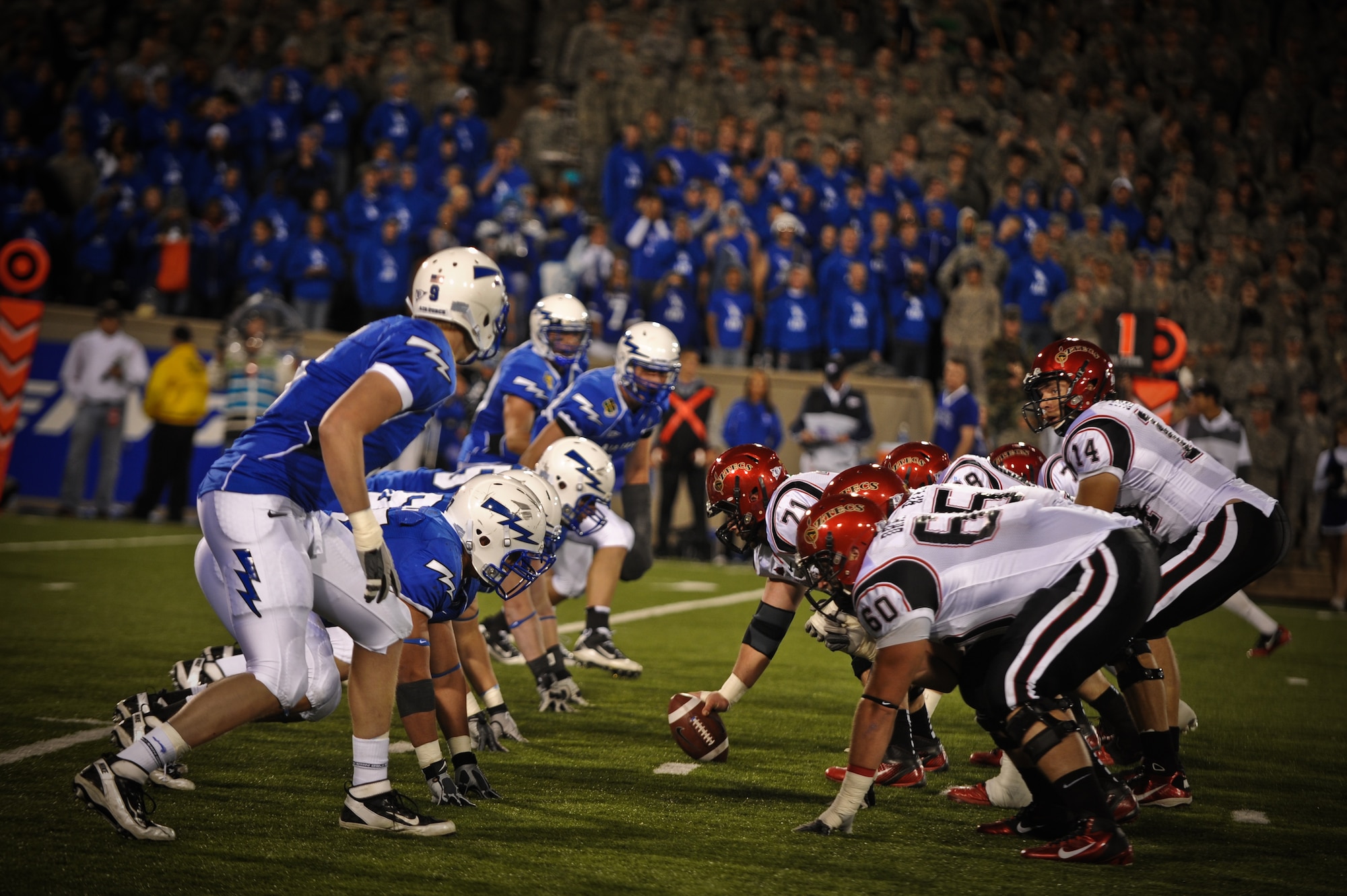 The U.S. Air Force Academy Falcons and the San Diego State University Aztecs line up for a play during a Falcons home game at Falcon Stadium in Colorado Springs, Co., Oct. 13. More than 4,000 cadets attended the game to support for their team. (U.S. Air Force Photo/Senior Airman Lauren Main)