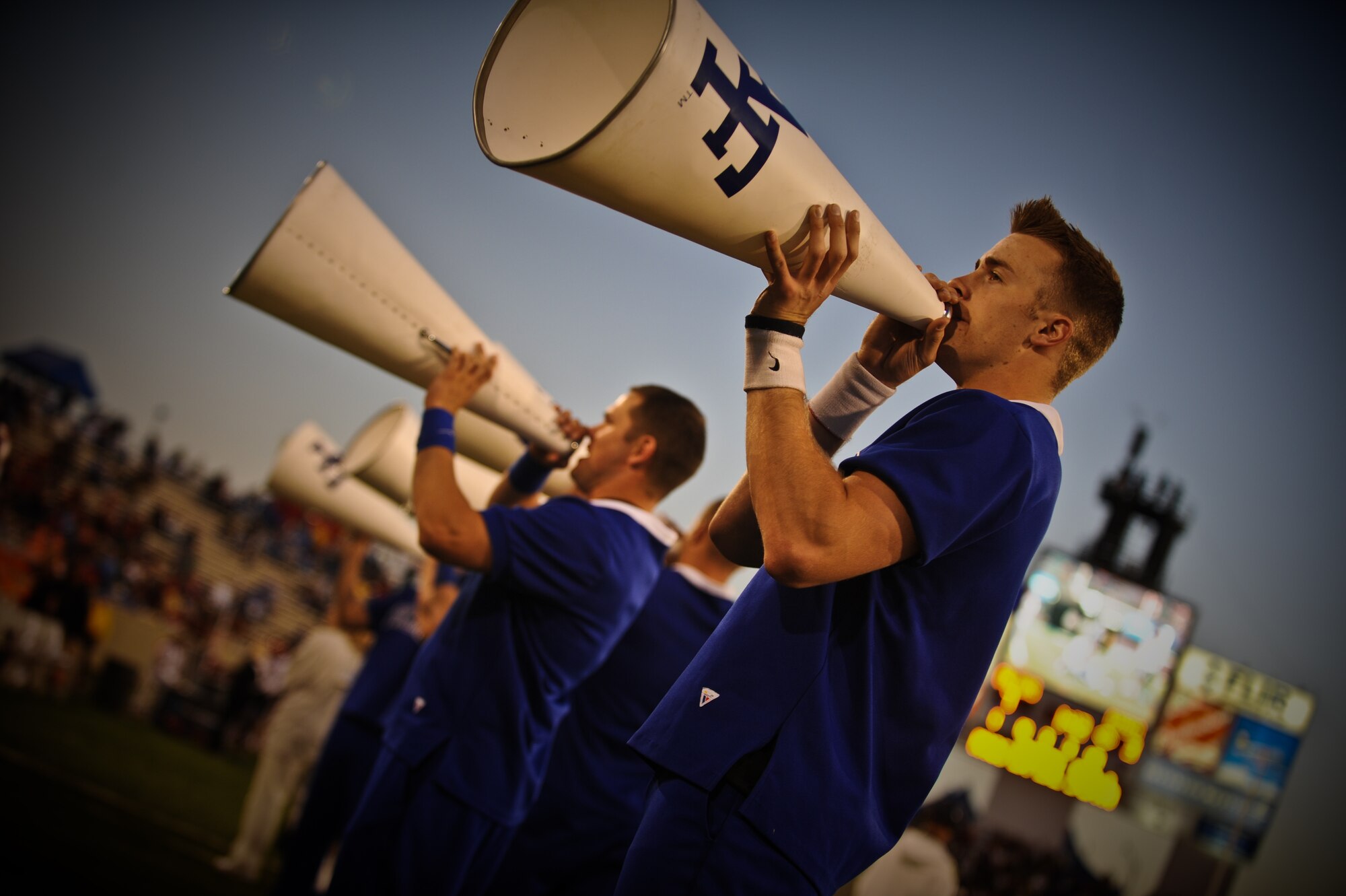 Members of the U.S. Air Force Academy Falcons football team attempt to take down a San Diego State University player during a game held at Falcon Stadium in Colorado Springs, Co., Oct. 13. While the Falcons didn't win, they didn't let the loss dent their pride. At the end of the game, fans and cadets alike gathered on the field to sing the Air Force song. (U.S. Air Force Photo/Senior Airman Lauren Main)