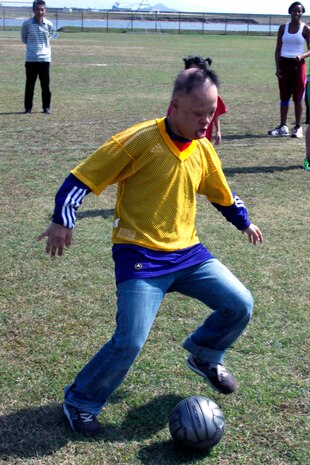 Kakuta Shotaro, 16, an experienced Special Olympian, kicks a soccer ball during a game at Penny Lake here Oct. 16. Shotaro didn’t score during the game, but he defended against many offensive plays. He participated in soccer for a majority of the day before all of the competitors went bowling.