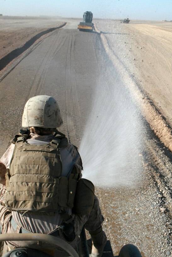Marines with 7th Engineer Support Battalion, 2nd Marine Logistics Group (Forward), continue work on Route Red in October 2011. As of Jan. 3, the surfacing portion of Route Red was completed by 9th ESB. The improved road will benefit locals by connecting several major population centers west of the Helmand River, which in turn, will promote economic growth in the region. (U.S. Marine Corps photo by Staff Sgt. Jeff Kaus)