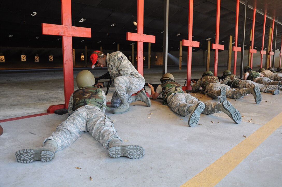 Members assigned to the 315th Security Forces Squadron who conduct combat arms training and maintenance, provide instruction and guidance during CATM qualification with Airmen assigned to the 560th Red Horse Squadron October 15, 2011 at Joint Base Charleston, S.C. (U.S. Air Force photo by Senior Airman Robert Pilch)