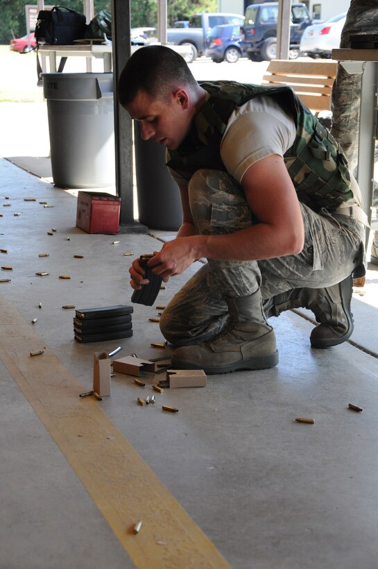Airmen from the 560th Red Horse Squadron,  Joint Base Charleston, S.C. qualify for combat arms training and maintenance October 15, 2011 at JB CHS. (U.S. Air Force photo by Senior Airman Robert Pilch)