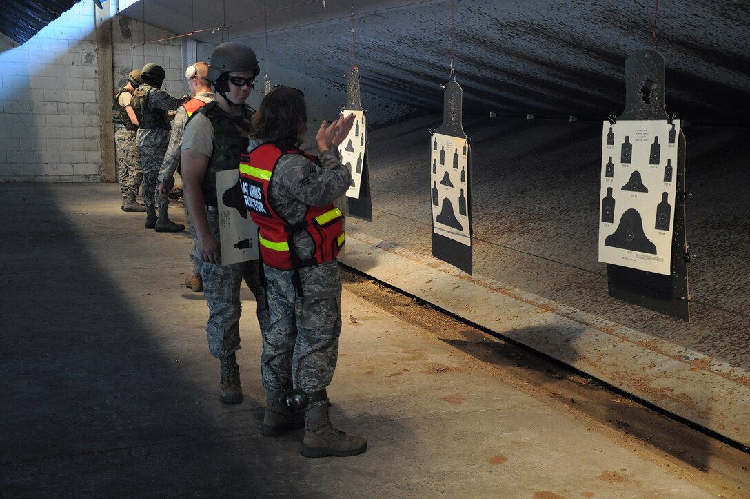Members assigned to the 315th Security Forces Squadron who conduct Combat Arms Training and Maintenance, provide instruction and guidance during CATM qualification with Airmen assigned to the 560th Red Horse Squadron October 15, 2011 at Joint Base Charleston, S.C. (U.S. Air Force photo by Senior Airman Robert Pilch)
