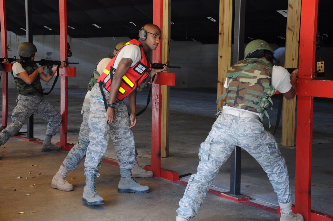 SrA Clevon Boyd, a combat arms training and maintenance instructor, assigned to the 315th Security Forces Squadron, provides instruction and guidance during CATM qualification with Airmen assigned to the 560th Red Horse Squadron October 15, 2011 at Joint Base Charleston, S.C. (U.S. Air Force photo by Senior Airman Robert Pilch)