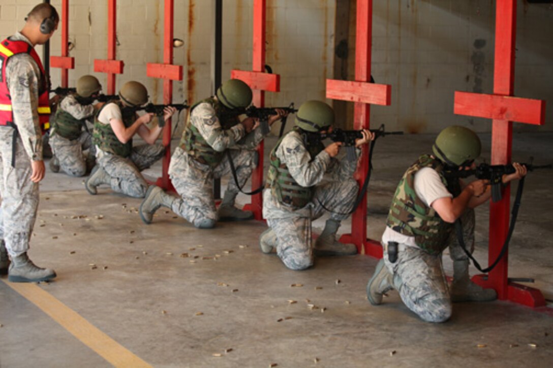 Members assigned to the 315th Security Forces Squadron who conduct Combat Arms Training and Maintenance, provide instruction and guidance during CATM qualification with Airmen assigned to the 560th Red Horse Squadron October 15, 2011 at Joint Base Charleston, S.C. (U.S. Air Force photo by Staff Sgt. Rashard Coaxum)