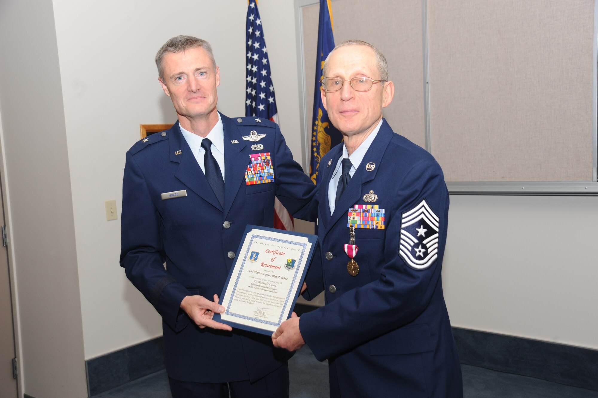 PORTLAND, Ore. - Command Chief Max White was honored in a ceremony to celebrate his retirement on October 16.Oregon Air National Guard Commander, Brig. Gen. Steven Gregg presents Command Chief with a Certificate of Retirement.( Air Force photo by Tech. Sgt John Hughel)