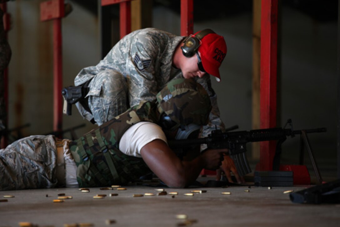 SSgt. Daniel Hudson, a combat arms training and maintenance instructor assigned to the 315th Security Forces Squadron,  provides instruction and guidance during CATM qualification with Airmen assigned to the 560th Red Horse Squadron October 15, 2011 at Joint Base Charleston, S.C. (U.S. Air Force photo by Staff Sgt. Rashard Coaxum)