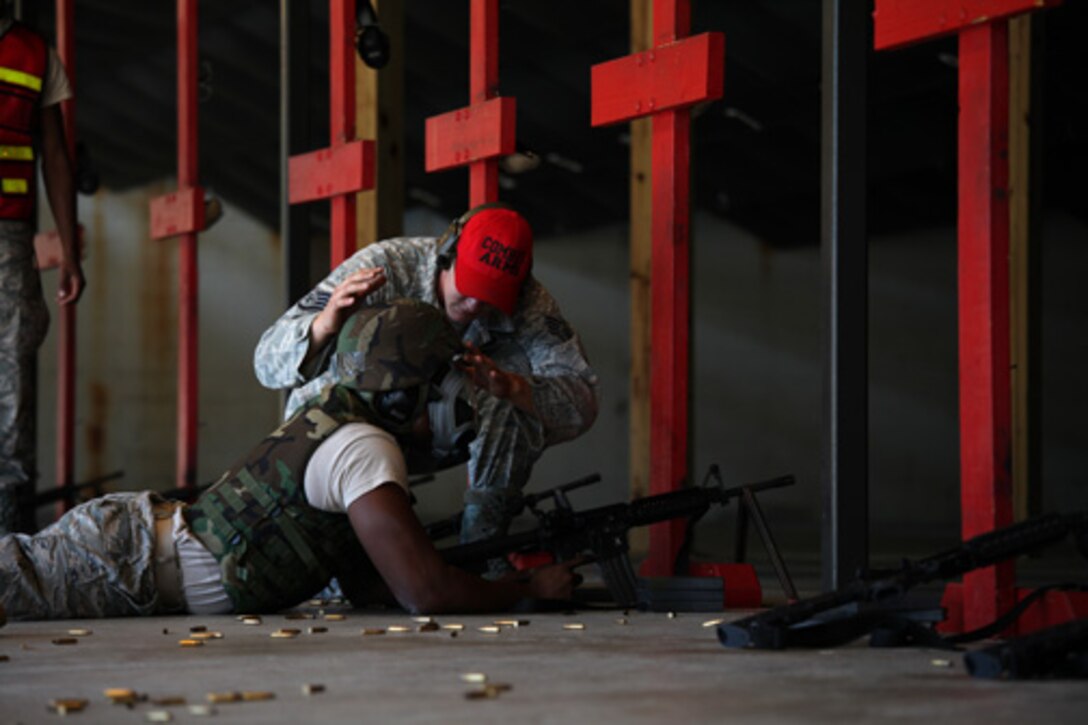 SSgt. Daniel Hudson, a combat arms training and maintenance instructor assigned to the 315th Security Forces Squadron,  provides instruction and guidance during CATM qualification with Airmen assigned to the 560th Red Horse Squadron October 15, 2011 at Joint Base Charleston, S.C. (U.S. Air Force photo by Staff Sgt. Rashard Coaxum)