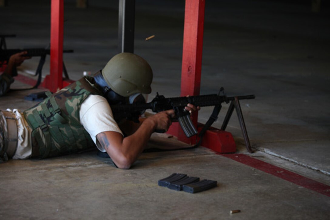 Members assigned to the 315th Security Forces Squadron who conduct Combat Arms Training and Maintenance, provide instruction and guidance during CATM qualification with Airmen assigned to the 560th Red Horse Squadron October 15, 2011 at Joint Base Charleston, S.C. (U.S. Air Force photo by Staff Sgt. Rashard Coaxum)