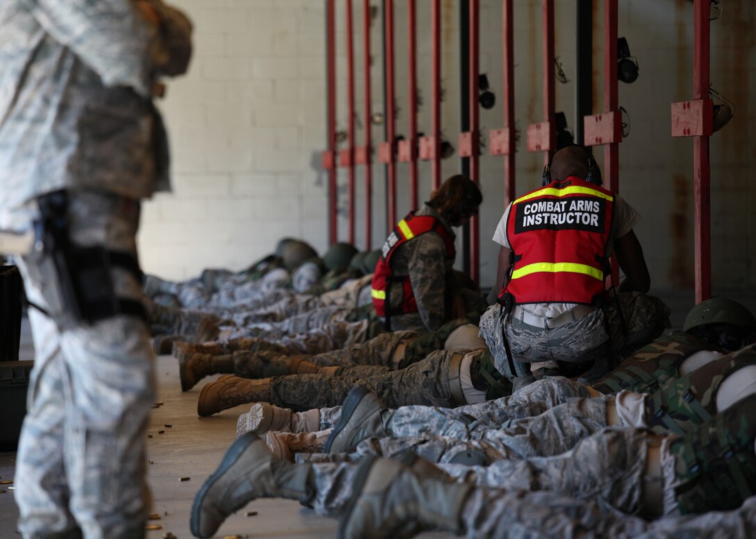 Members assigned to the 315th Security Forces Squadron who conduct Combat Arms Training and Maintenance, provide instruction and guidance during CATM qualification with Airmen assigned to the 560th Red Horse Squadron October 15, 2011 at Joint Base Charleston, S.C. (U.S. Air Force photo by Staff Sgt. Rashard Coaxum)