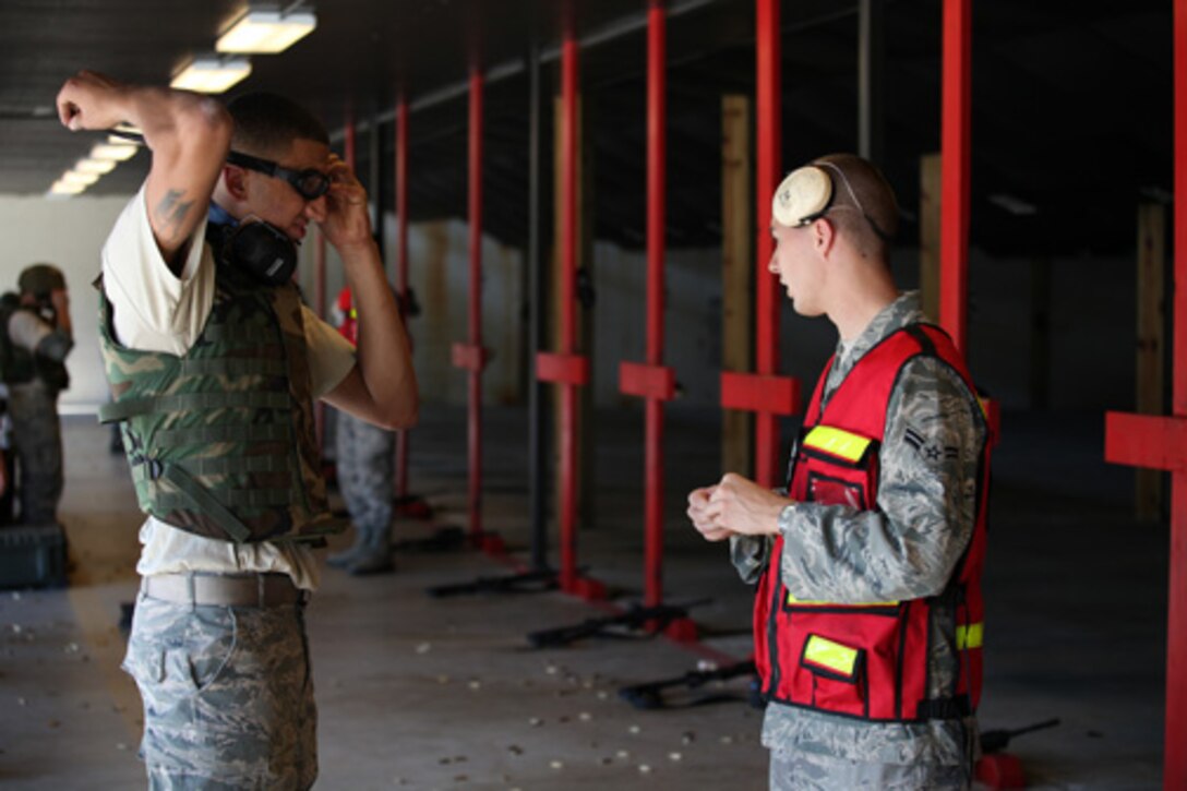 Members assigned to the 315th Security Forces Squadron who conduct Combat Arms Training and Maintenance, provide instruction and guidance during CATM qualification with Airmen assigned to the 560th Red Horse Squadron October 15, 2011 at Joint Base Charleston, S.C. (U.S. Air Force photo by Staff Sgt. Rashard Coaxum)